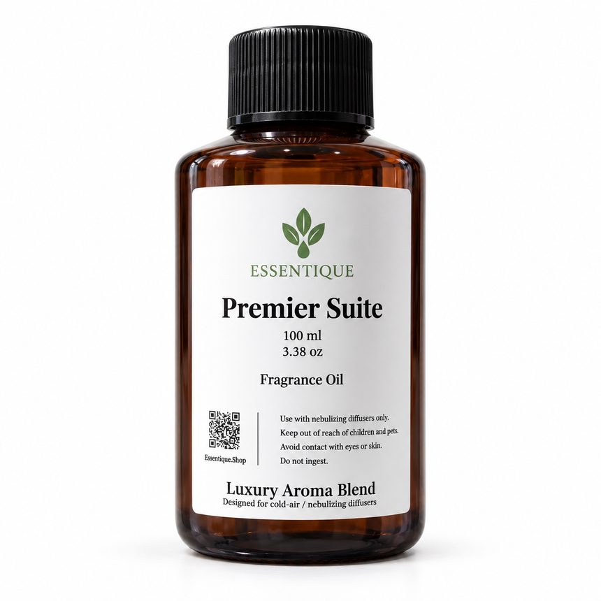 Essentique Premier Suite 100 mL fragrance oil
in an amber bottle with a black cap and white
front label on a white background.
