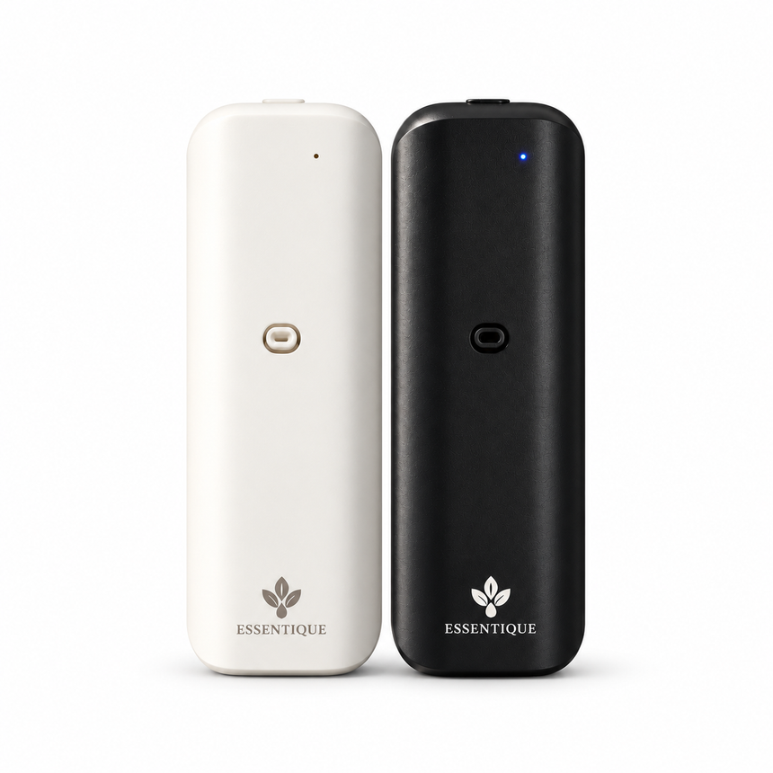 White and black Essentique The Pulse diffusers standing side by side at matching height on a white background.
